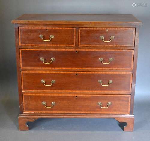 An Edwardian Mahogany Satinwood Inlaid Chest of two short and three long drawers with brass swan