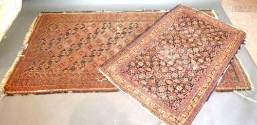 A North West Persian Woollen Rug with an all-over design upon a red, blue and cream ground within