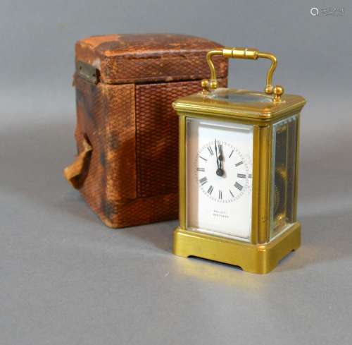 A French Brass Cased Miniature Carriage Clock, the enamel dial with Roman numerals and inscribed