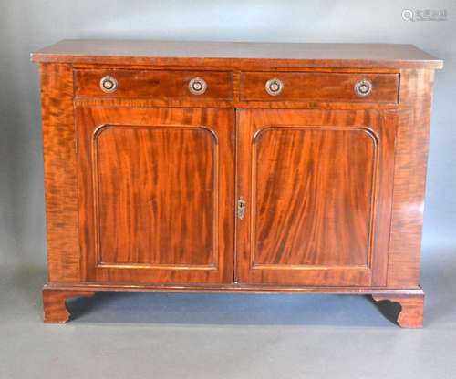 A 19th Century Mahogany Chiffonier with two frieze drawers above two panelled doors, raised upon