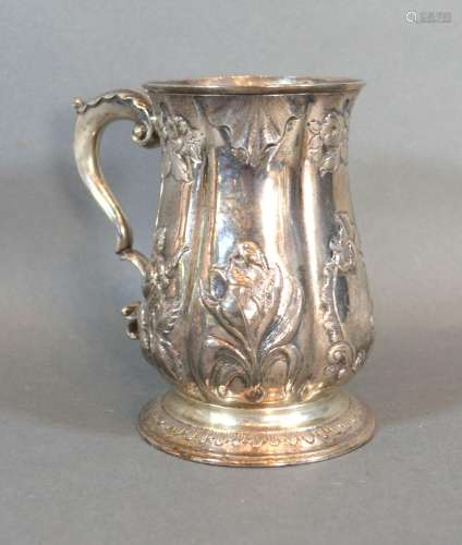 A George II Silver Presentation Mug with Foliate Embossing and Shaped Handle and bearing inscription