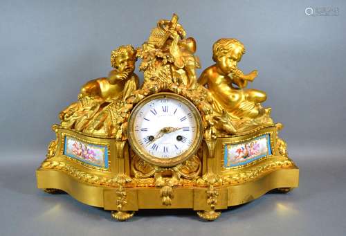 An Early 19th Century French Ormolu Mantle Clock by Raingo Freres Paris, the putti surmount with