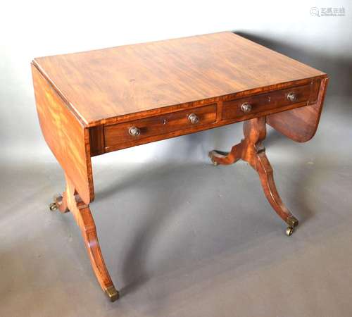 A Regency Mahogany Sofa Table with line inlaid top above two frieze drawers opposed by dummy drawers