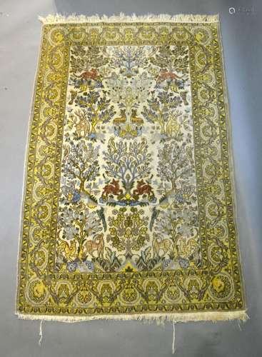 A North West Persian Pictorial Woollen Rug with an all-over design depicting animals amongst foliage