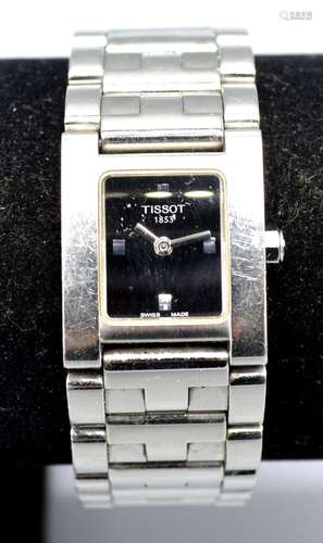 A Tissot Stainless Steel Cased Ladies Wristwatch with rectangular black dial and linked stainless