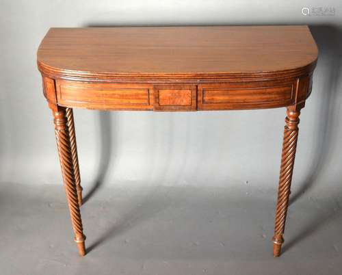 A 19th Century Mahogany Tea Table, the reeded hinged top above an inlaid frieze raised upon spiral