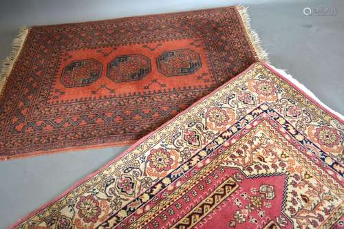 A Bokhara Woollen Rug with three central medallions with a red ground in multiple boarders 145cm x