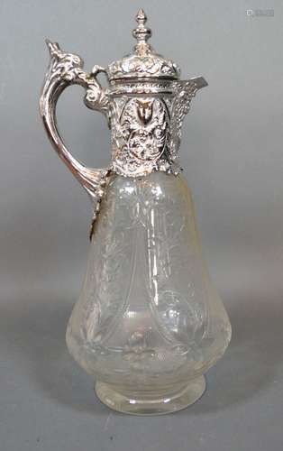 A Victorian and Silver Cut Glass Claret Jug with shaped handle and with foliate etching. London