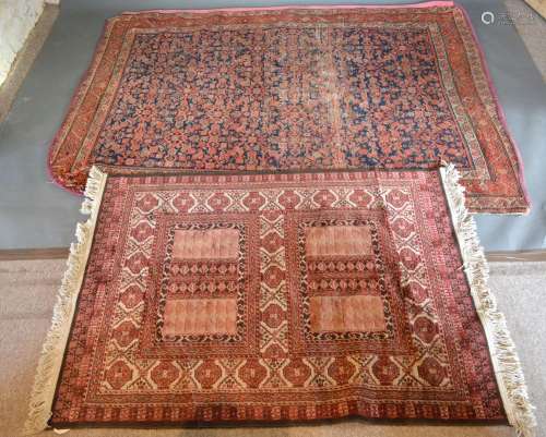 A Northwest Persian Woollen Rug with an all over design upon a blue red and cream ground within