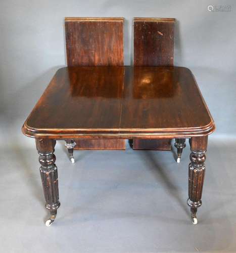 A Victorian Mahogany Wind-Out Extending Dining Table, the moulded top above four reeded tapering