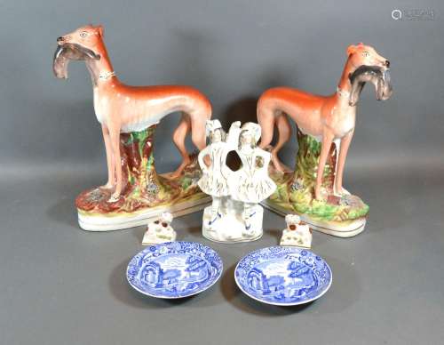 A Pair of Staffordshire Models of Greyhounds together with a Staffordshire group, a pair of small