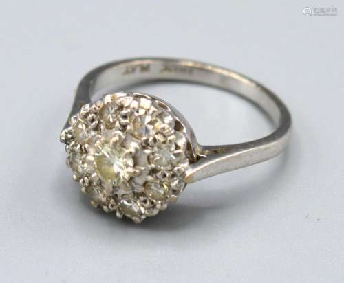An 18ct. Gold Diamond Cluster Ring set with many diamonds within a pierced setting, 3.5 gms. ring