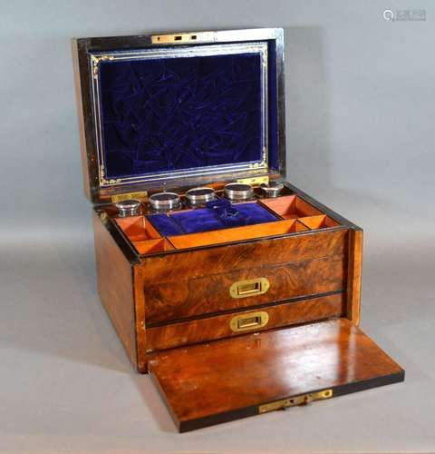 A Victorian Walnut Dressing Case retailed by Cormack Brothers London, the hinged cover enclosing a