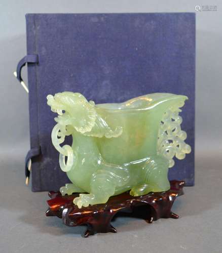 A 20th Century Chinese Jade Model in the form of a Jug with serpents head handle and hardwood