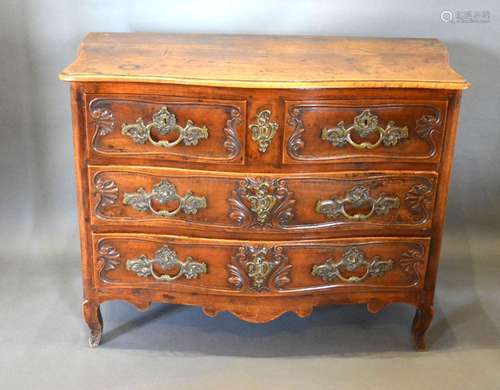 An 18th Century Oak Serpentine Commode, the moulded top above two short and two long drawers with