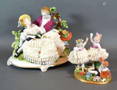 A German Porcelain Group 'The Courting Couple' with crinoline dress decorated in polychrome