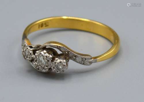 A 18ct Yellow Gold Diamond ring set with three diamonds within a crossover setting, Size R, 3.3