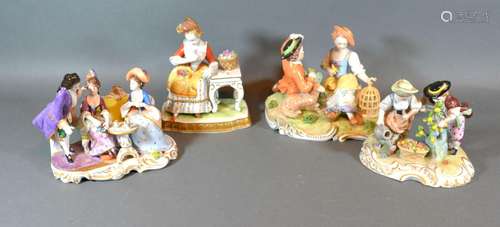 A German Porcelain Group depicting Figures Around a Table decorated in polychrome enamels and