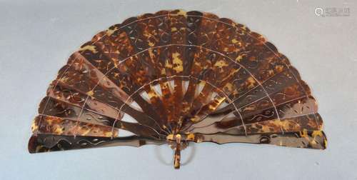 A Victorian Tortoiseshell Brise Fan with carved and pierced sticks and guards 20cm