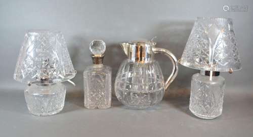 A Cut Glass and Silver Mounted Decanter together with two cut glass lamps and shades and a silver