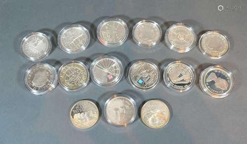 A 2012 Silver Proof Coin commemorating The Olympics together with another similar and thirteen other