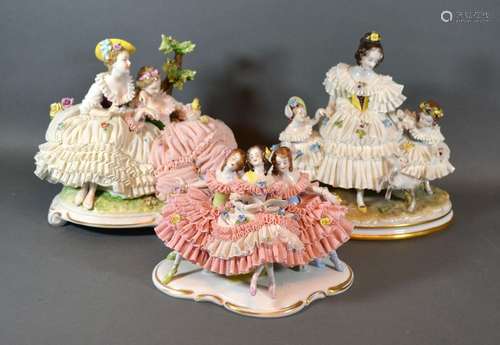 A Dresden Porcelain Group in the form of Three Girls with Crinoline Dresses decorated in