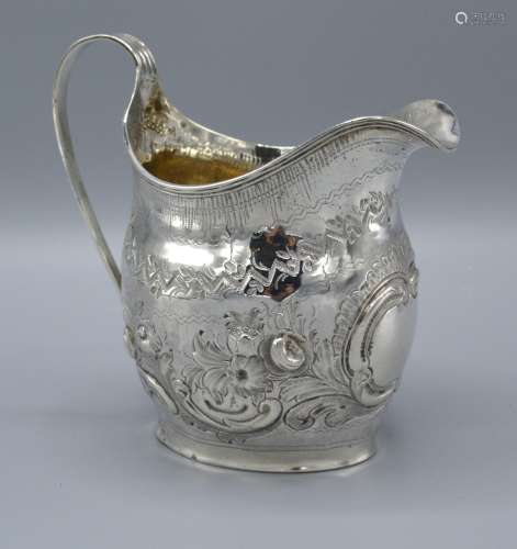 A George III Silver Jug of Embossed Form with Reeded Handle, London 1802, 4oz