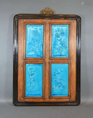 A Chinese Panel Inset with four blue glazed porcelain panels 58cm x 43cm