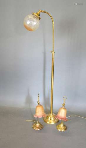 A Pair of Brass Adjustable Table Lamps together with a similar brass adjustable lamp standard