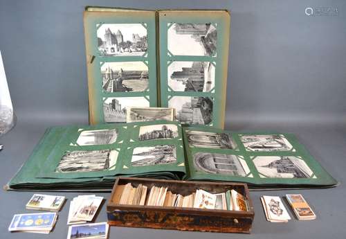 Two Postcard Albums, French, Black and White, together with a small collection of Cigarette Cards