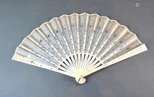 An Ivory and Gauze Leaf Fan with carved ivory sticks and guards and with sequin decorated gauze leaf