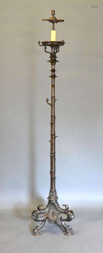 An Early 20th Century Patinated Bronze Lamp Standard in the form of Bamboo, the tri-form base with