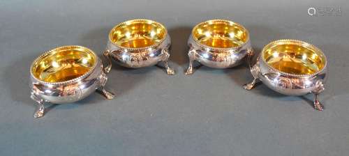 A Set of Four Victorian Silver Salts of Circular Form with Silver gilt interiors each engraved