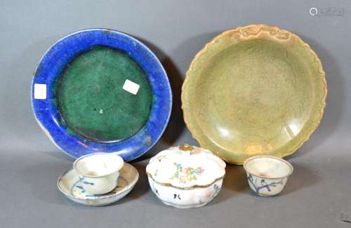 An Early Chinese Green Glazed Dish together with another dish, two tea bowls, a saucer and a
