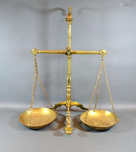 A Set of Brass Balance Scales by Doyle & Sons London, 56 cms tall