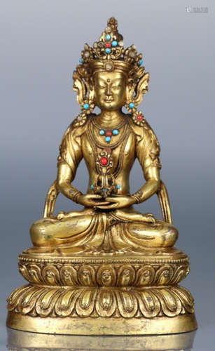 A GILT BRONZE LONGEVITY BUDDHA STATUE