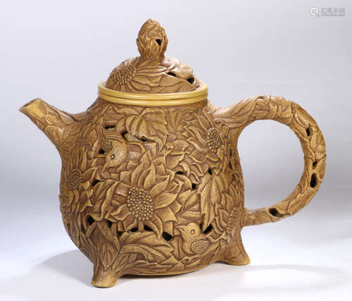 A ZISHA TEA POT CARVED WITH FLOWER PATTERN