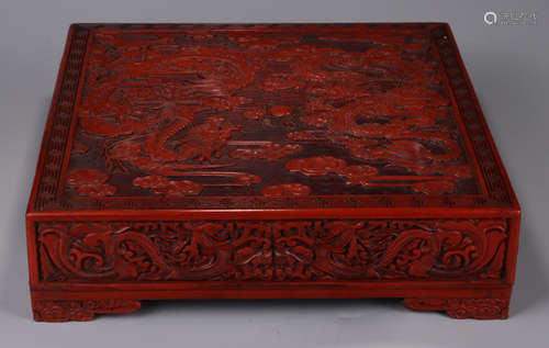 A RED LACQUER BOX CARVED WITH DRAGON PATTERN