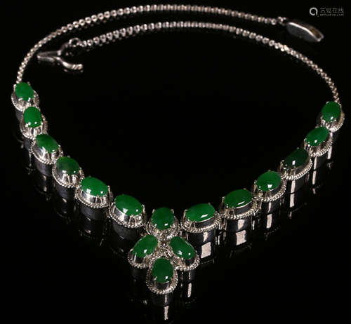 AN ICEY JADEITE AND SILVER NECKLACE