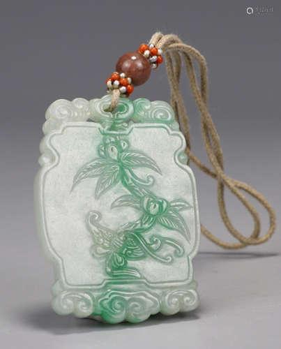 A JADEITE TABLET CARVED WITH FLOWER PATTERN