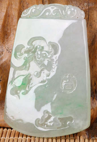 AN ICEY JADEITE TABLET CARVED WITH DRAGON