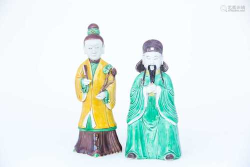 Two Chinese biscuit porcelain sancai glaze figures, Kangxi, early 18th century, modelled as a seated