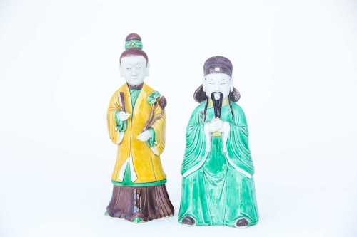 Two Chinese biscuit porcelain sancai glaze figures, Kangxi, early 18th century, modelled as a seated