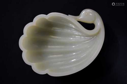 A fine white jade brush washer, 18th century, in the form of a duck, its head turned backwards