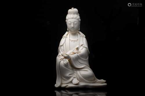 A Chinese blanc de Chine figure of Guanyin, 20th century, modelled seated, gazing serenely