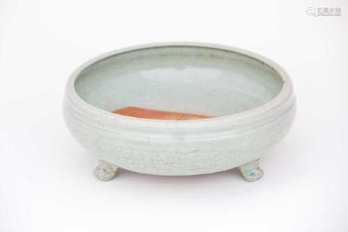 A Chinese celadon bowl, 14th/15th century, with incurved rim above a body engraved with flowers