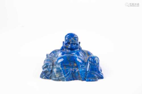 A Chinese carved Lapis Lazuli Budai, early 20th century, the smiling figure flecked with gold