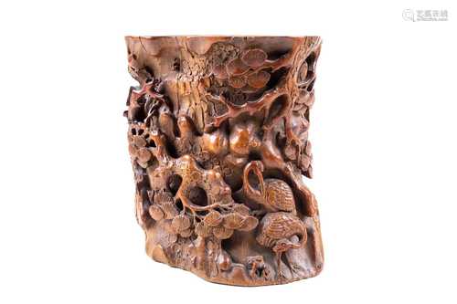 A Chinese carved bamboo brush pot, late Ming Dynasty, carved and pierced with two Manchurian