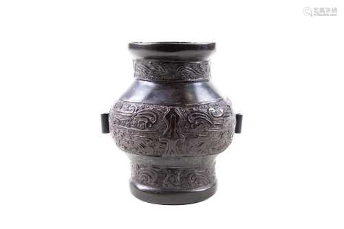 A bronze Hu, probably Ming dynasty, the ovoid body with relief stylised dragons and archaic