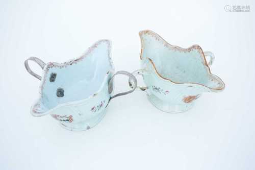 A Pair of Chinese porcelain export armorial sauceboats, mid 18th century, of double ended boat